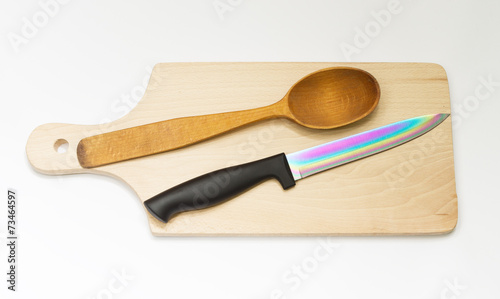 Obraz na płótnie One wooden spoon and knife on the board w salonie