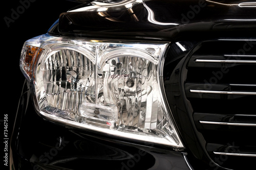 Car headlights. Exterior detail. © alexdemeshko
