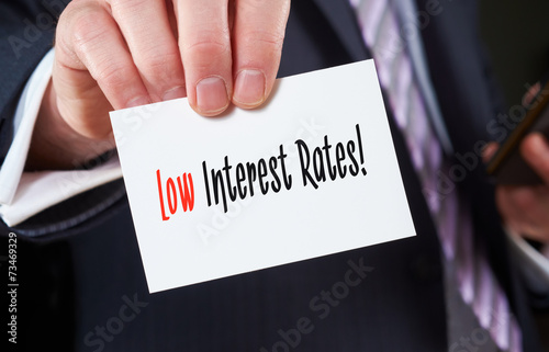 Business card with the words, Low Interest Rates, written on it.