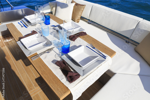 lunch on motor yacht  Table setting at a luxury yacht.