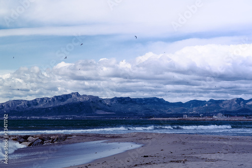 Berge hinterm Strand von Cambrils photo