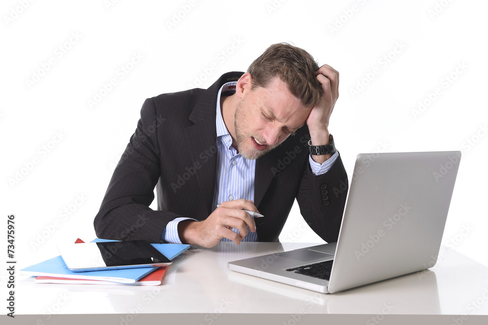 businessman working in stress at office desk suffering headache businessman working in stress at office desk suffering headache