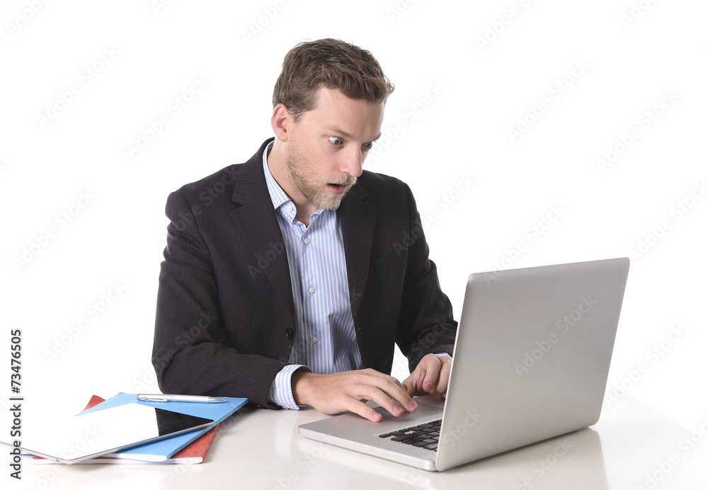 attractive businessman working in shock at office attractive businessman working in shock at office