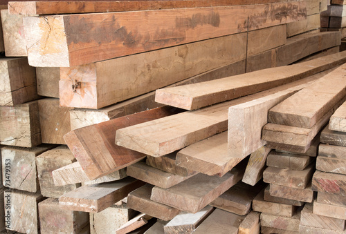 stack of lumber in timber logs storage for construction or indus