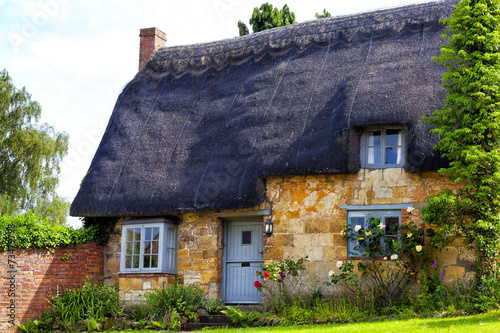 Traditional Old English Cottage with Thatched Roof
