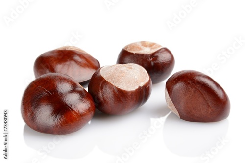 Closeup shot few chestnuts isolated on white background