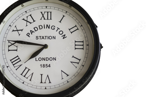 Old clock of Paddington Station in London with roman numbers