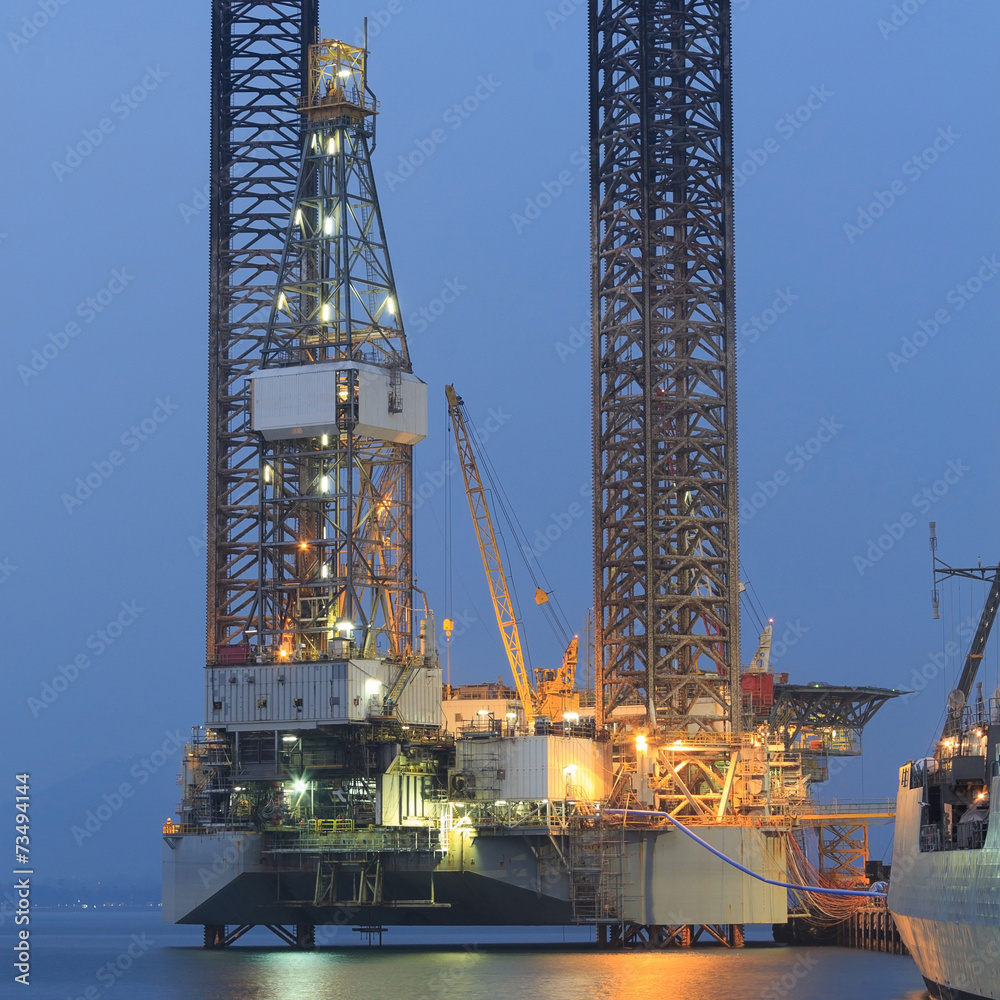 Jack up oil drilling rig in the shipyard in the evening Stock Photo ...
