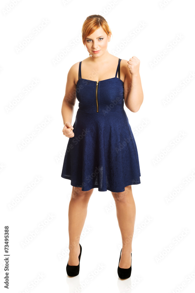 Overweight woman with her fists up Overweight woman with her fists up