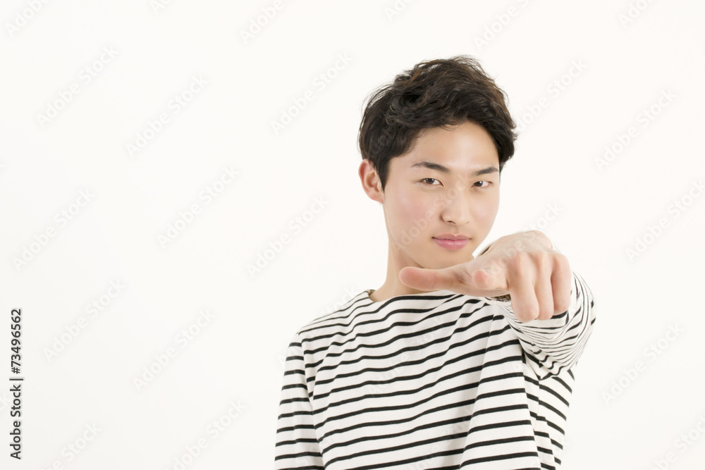 Young asian man pointing at you Young asian man pointing at you