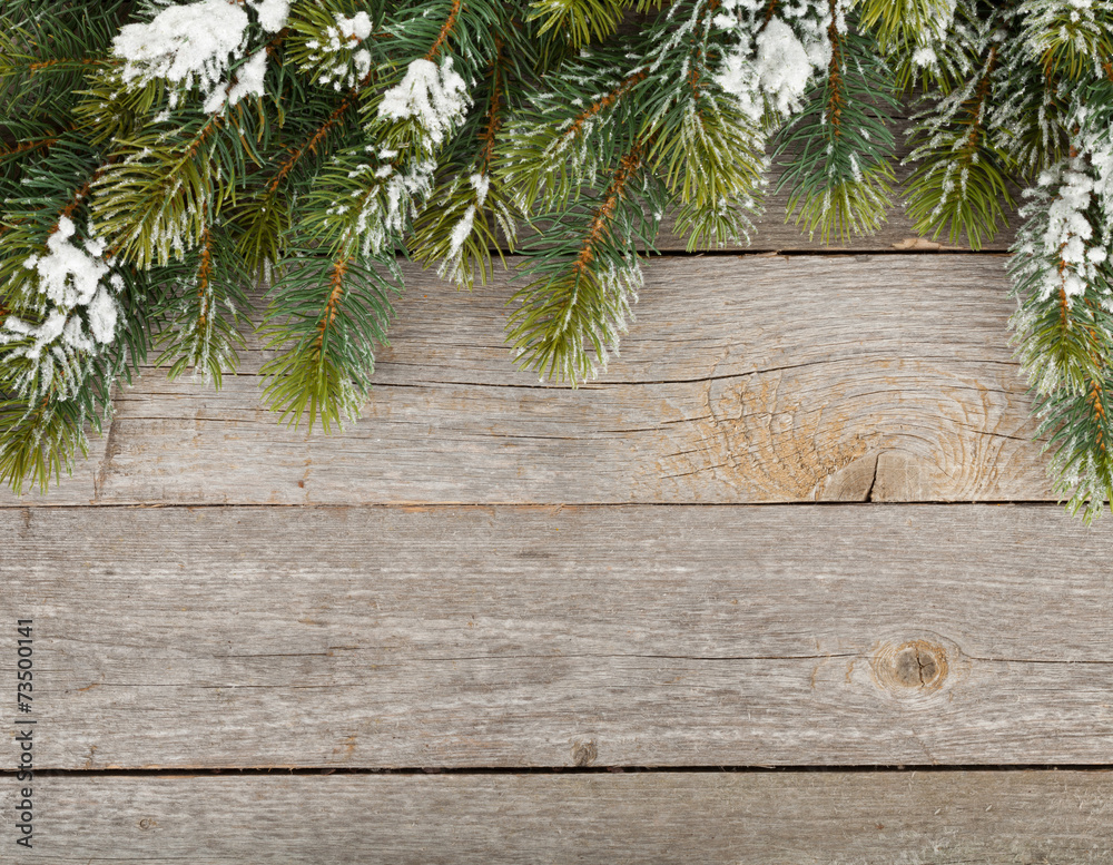 Christmas fir tree on wooden board background Christmas fir tree on wooden board background