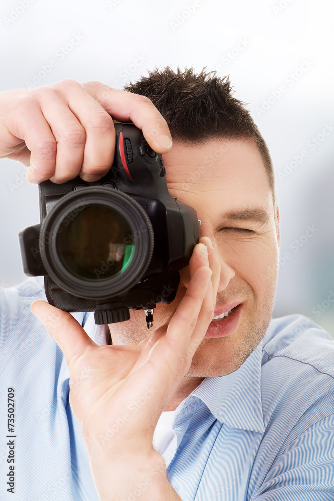 Obraz premium Man photographer with DSLR