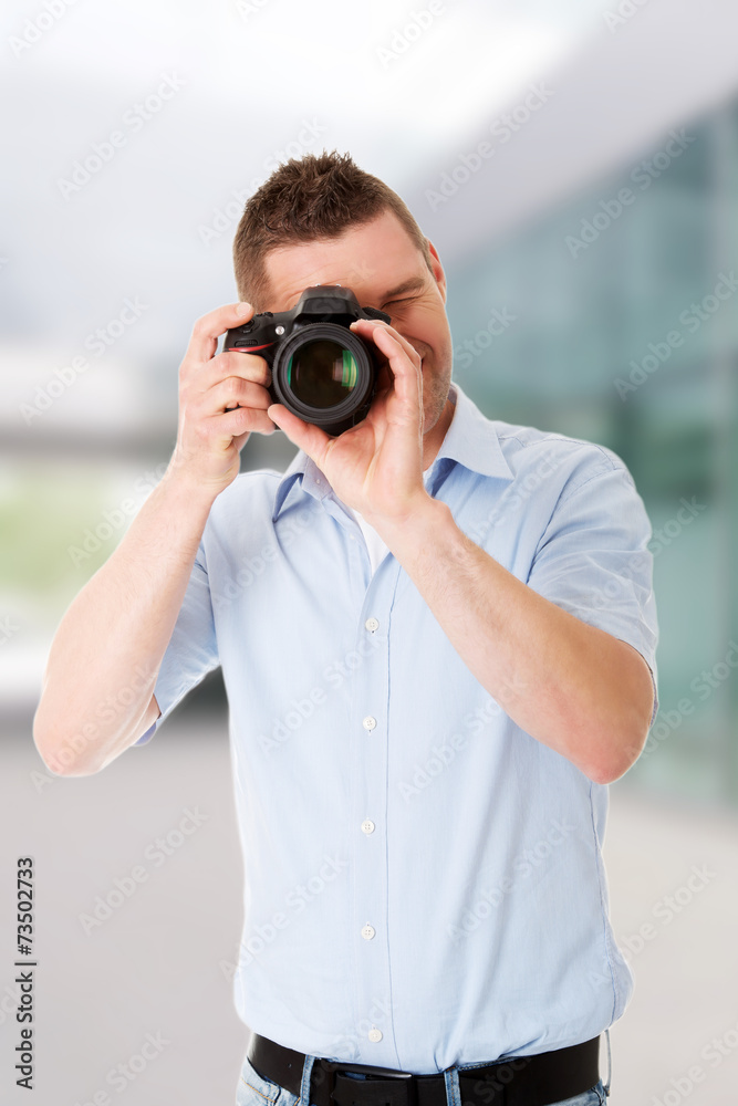 Man photographer with DSLR Man photographer with DSLR