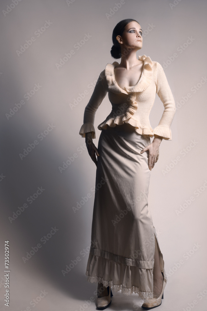 Fototapeta premium Elegant woman in long skirt white dress