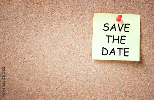 sticky pinned to cork board with the phrase save the date. room 