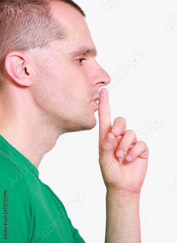 Man showing hand silence sign