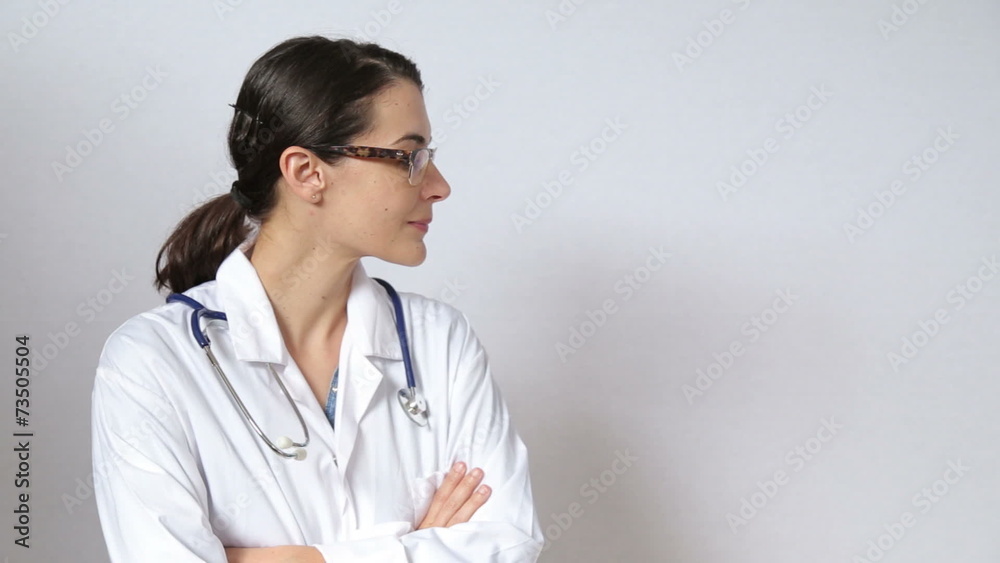 attractive female doctor looking straight at the camera attractive female doctor looking straight at the camera