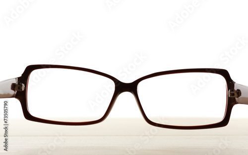 Eye glasses on table on white background