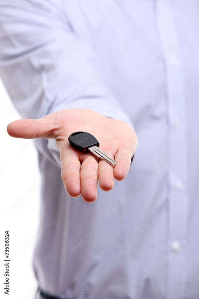 Businessman holding car key isolated on white Businessman holding car key isolated on white