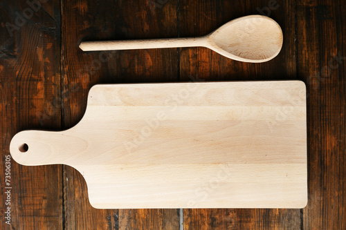 Empty cutting board on wooden background