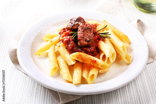 Tasty pasta with meat on table