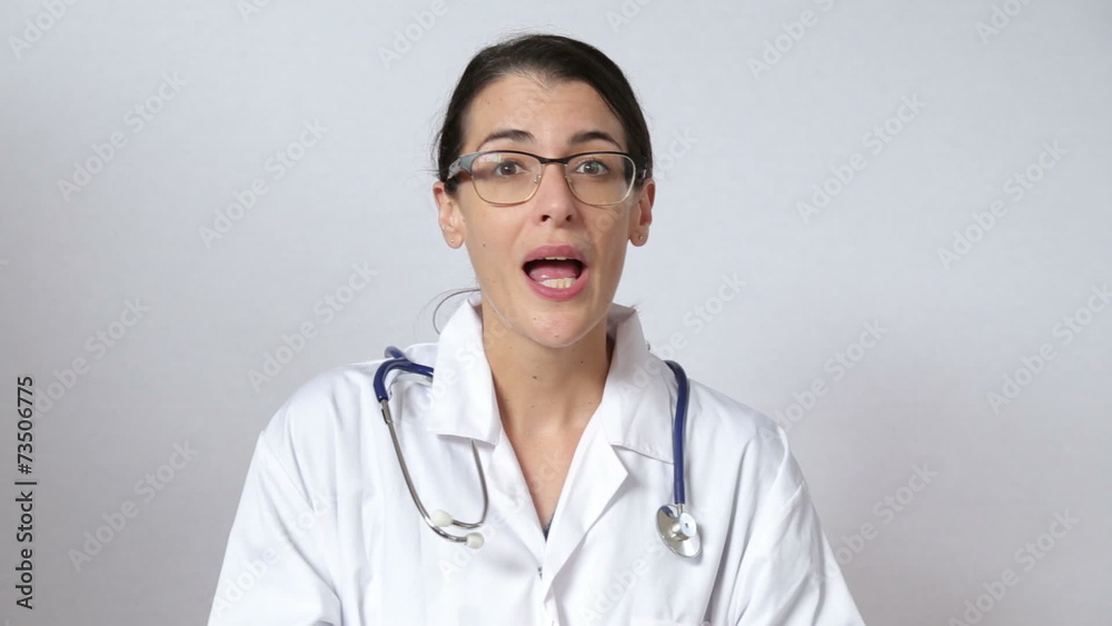 attractive female doctor looking straight at the camera attractive female doctor looking straight at the camera