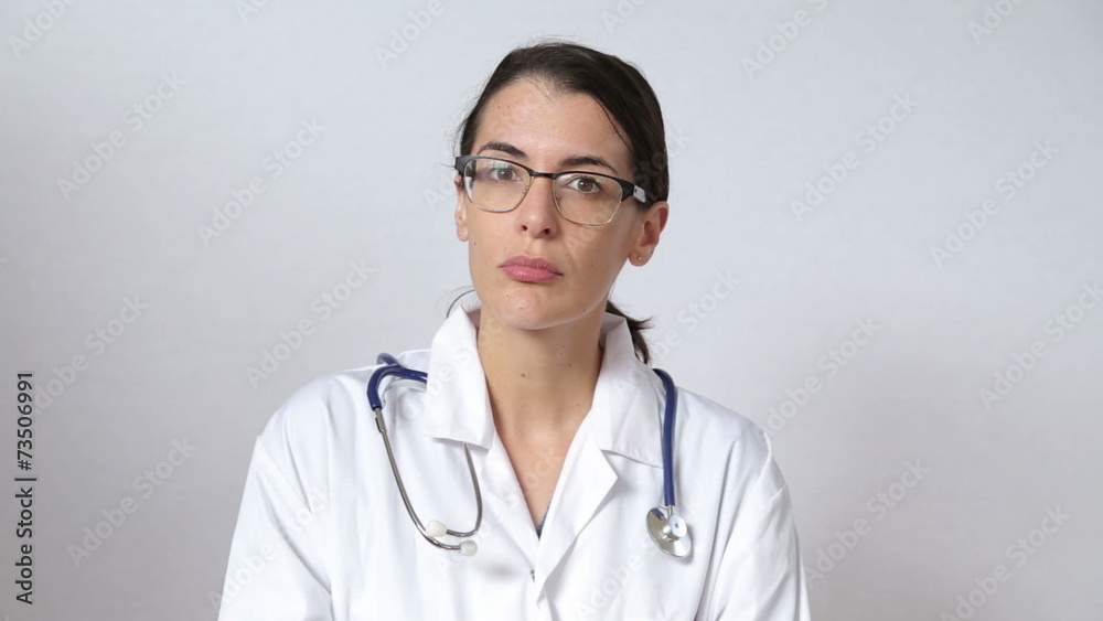 attractive female doctor looking straight at the camera attractive female doctor looking straight at the camera