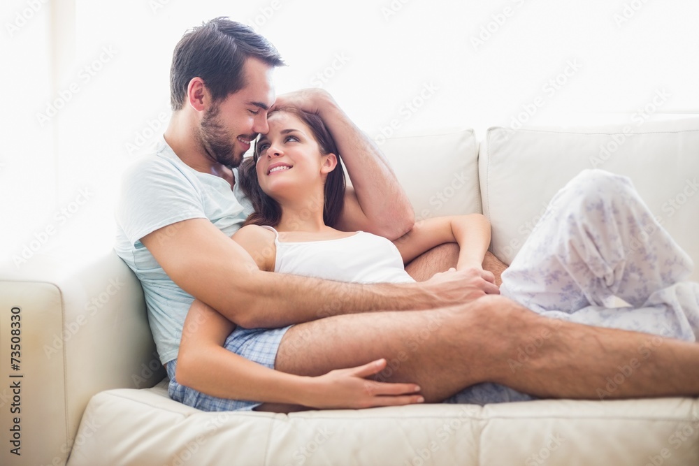 Cute couple relaxing on couch Cute couple relaxing on couch