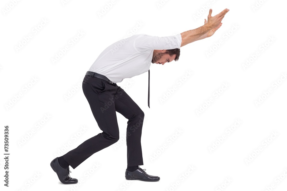 Stylish businessman standing and pushing up Stylish businessman standing and pushing up