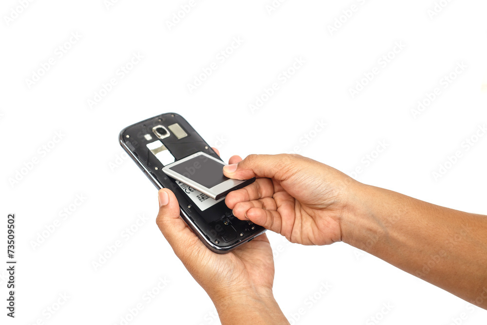 Hand holding battery of smartphone isolated on white background Hand holding battery of smartphone isolated on white background