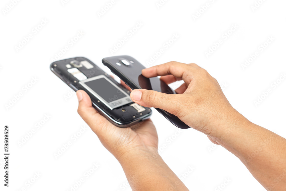 Hand holding smartphone and open backside cover isolated on whit Hand holding smartphone and open backside cover isolated on whit