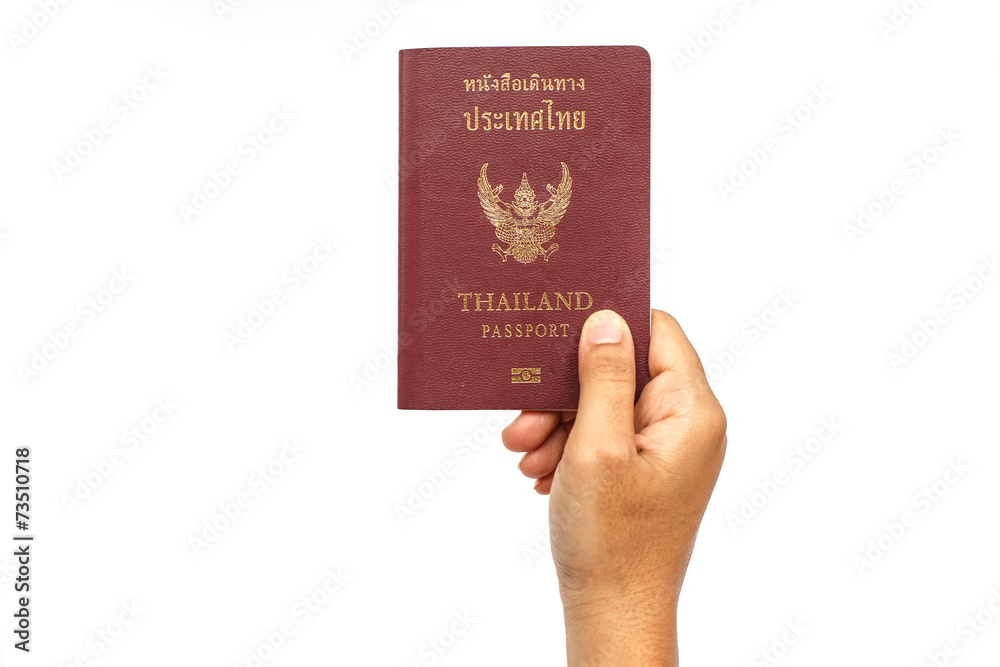 Hand holding Thailand passport isolated on white background Hand holding Thailand passport isolated on white background