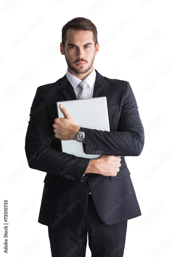 Businessman in suit posing with his laptop Businessman in suit posing with his laptop