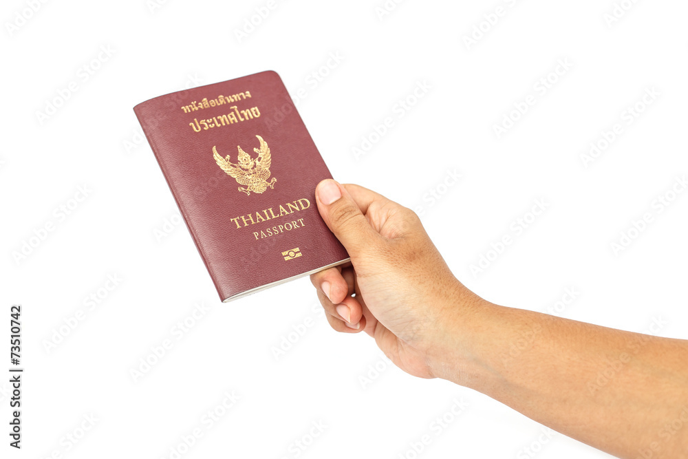 Hand holding Thailand passport isolated on white background Hand holding Thailand passport isolated on white background