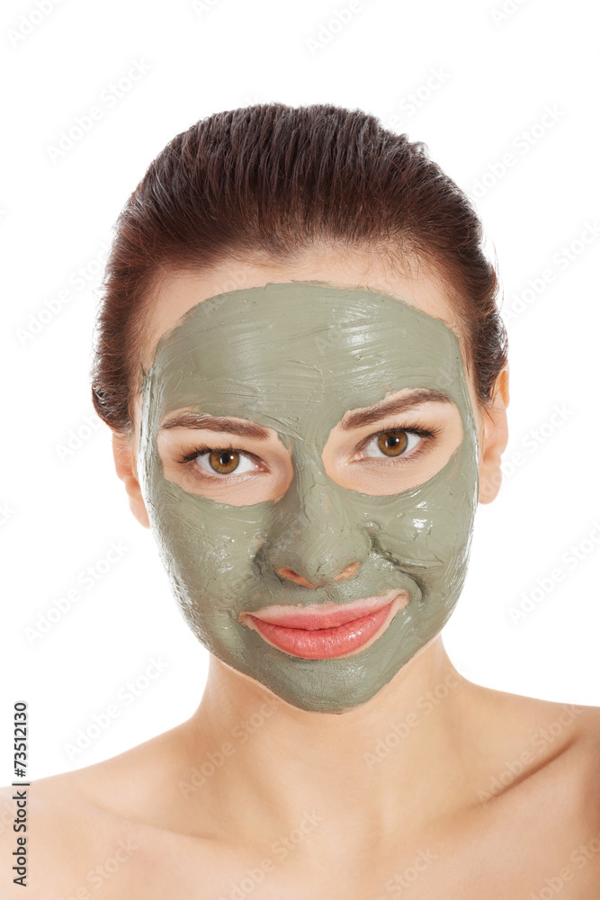 Portrait of a woman in green face mask