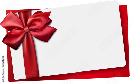 White paper card with gift red satin bow. photo