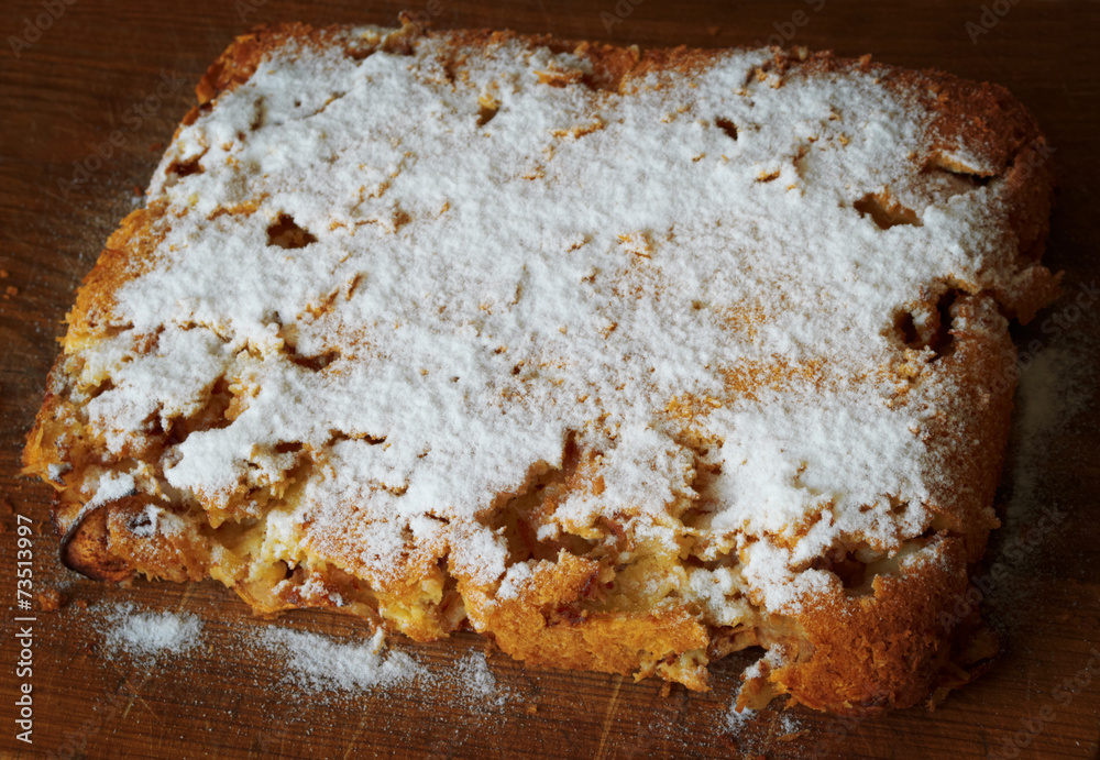 Fototapeta premium homemade apple pie, sprinkled with powdered sugar