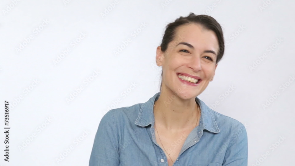 Lovely actor smiling to the camera holding a movie clapper Lovely actor smiling to the camera holding a movie clapper