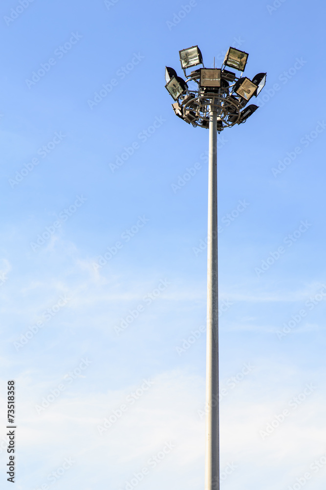 Spot light pole with blue sky in the stadium Spot light pole with blue sky in the stadium