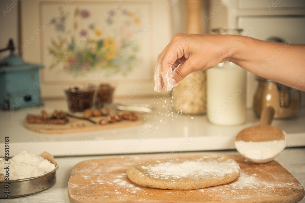 Sprinkling dough with flour Sprinkling dough with flour