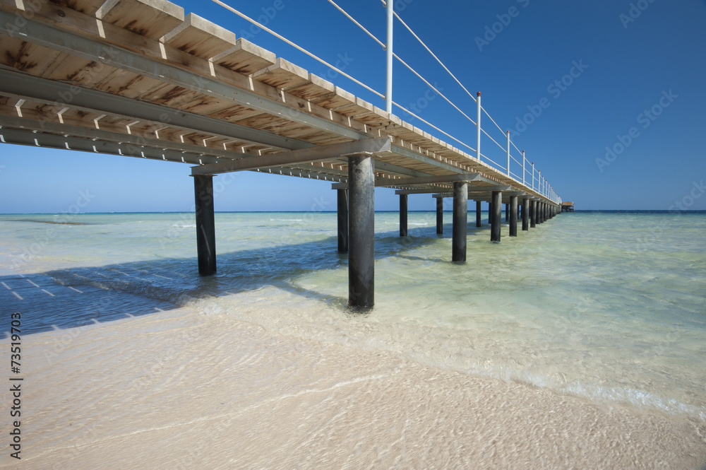 Fototapeta premium Wooden jetty on tropical beach