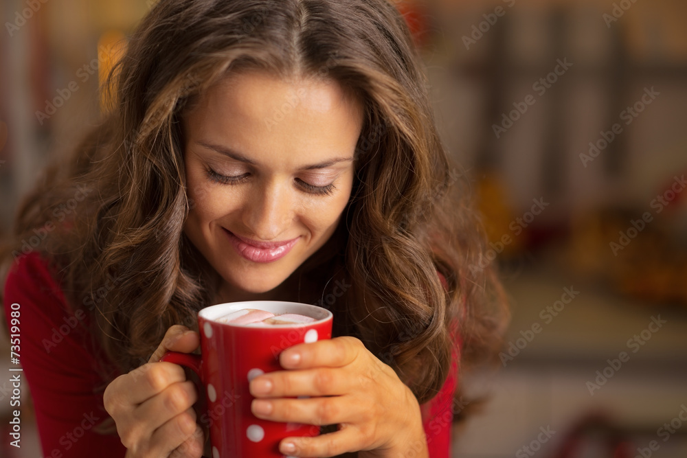 Portrait of happy young woman with cup of hot chocolate Portrait of happy young woman with cup of hot chocolate