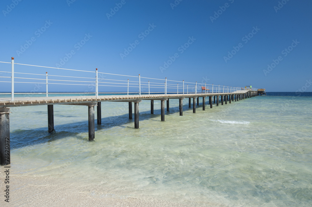 Wooden jetty on tropical beach