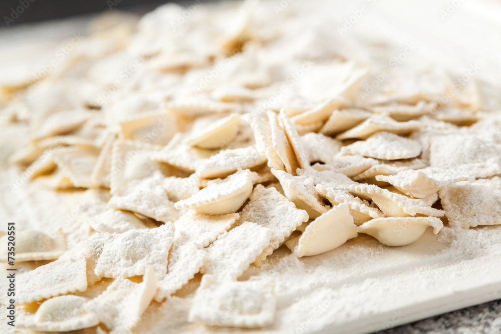 Flour On Raw Ravioli Pasta At Counter Flour On Raw Ravioli Pasta At Counter