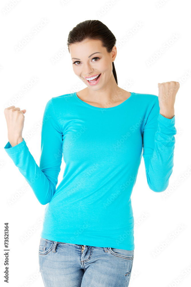 Full length woman making winner gesture Full length woman making winner gesture