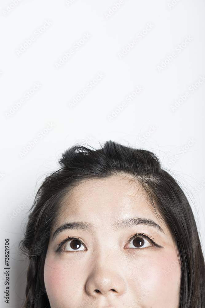Female eyes looking up - isolated over a white background Female eyes looking up - isolated over a white background