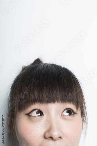 Female eyes looking up - isolated over a white background
