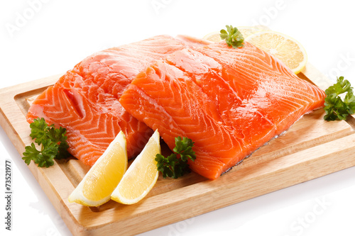 Fresh raw salmon fillet on cutting board