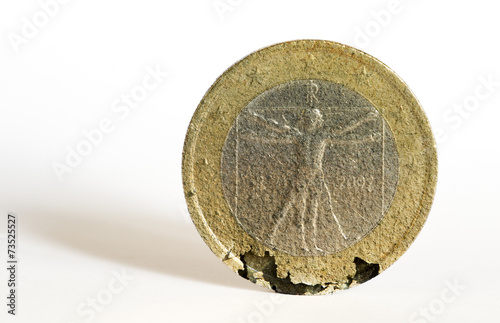 One euro coin crumbles under the strain of the economic crisis.