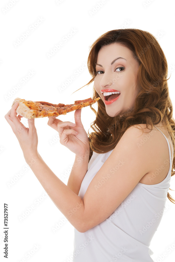 Side view of a woman eating pizza Side view of a woman eating pizza